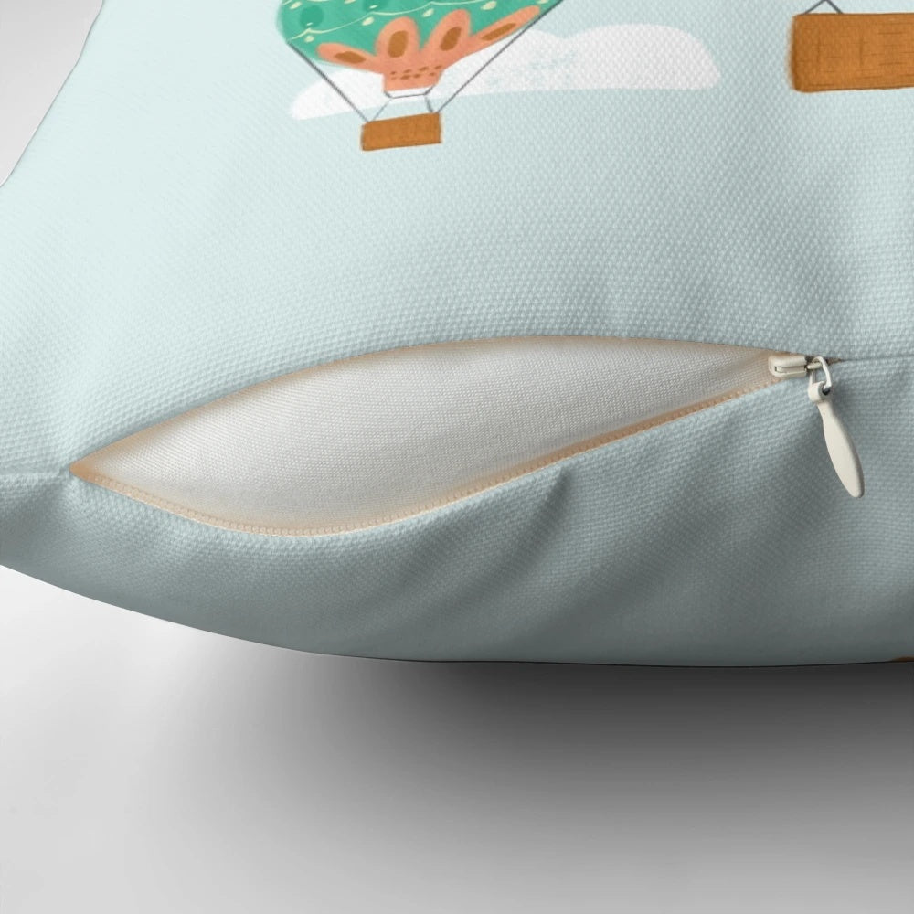 Colorful hot air balloon illustration on a plush pillow, perfect for a child's room or nursery