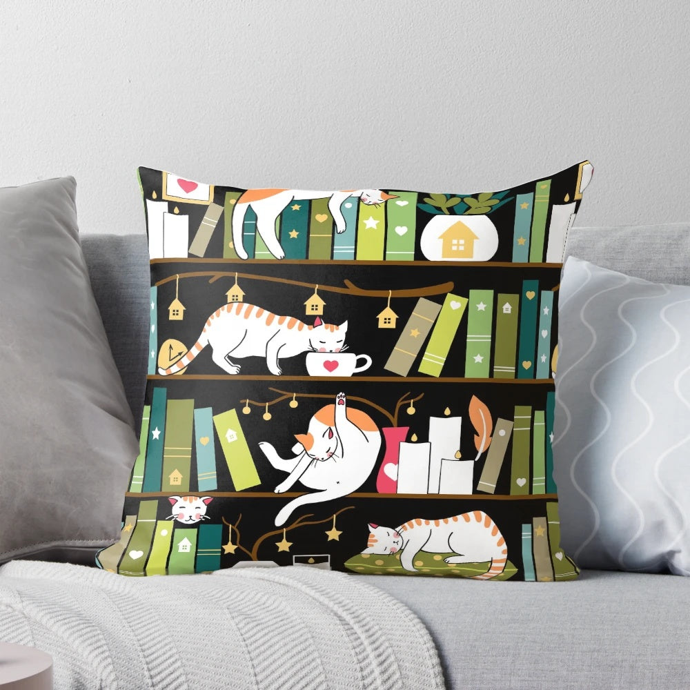 Whimsical library cats sitting on book shelves printed on a decorative throw pillow