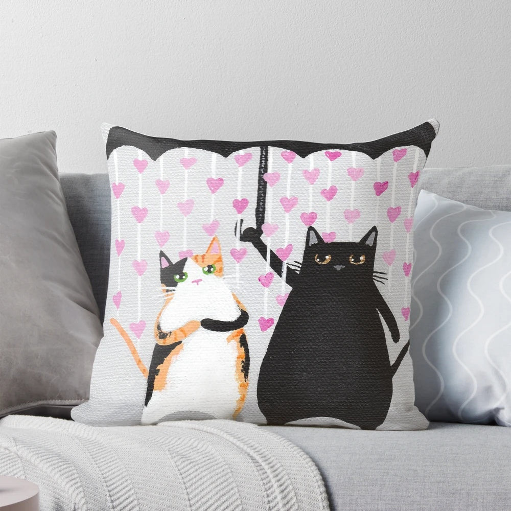 Whimsical decorative throw pillow featuring a design of love cats with raining hearts in calico and black