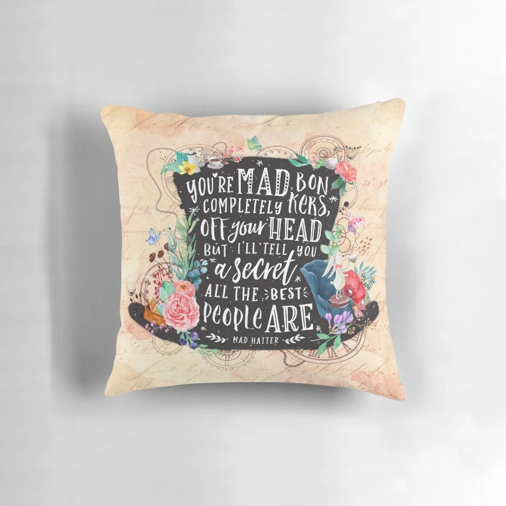 Mad Hatter inspired decorative pillow featuring a whimsical watercolor design with silhouettes, floral elements, and steampunk gears.