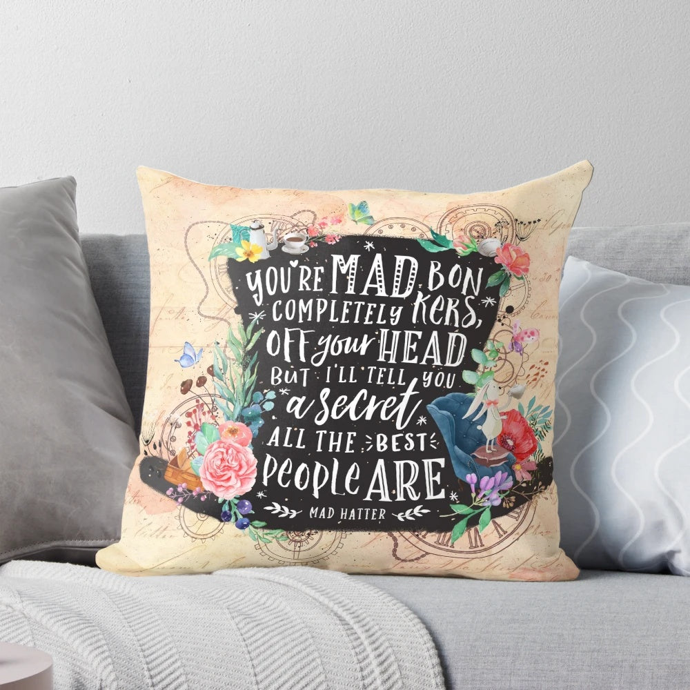 Mad Hatter inspired decorative pillow featuring a whimsical watercolor design with silhouettes, floral elements, and steampunk gears.