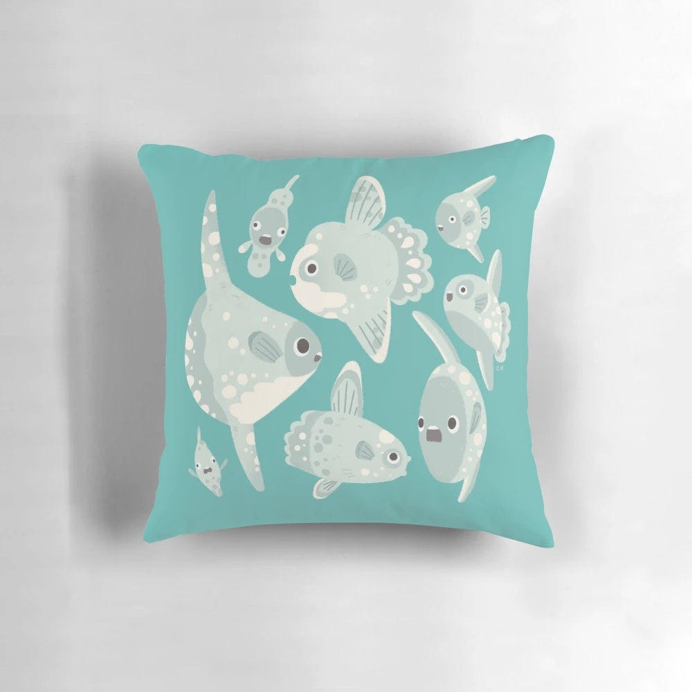 Artistic illustration of a mola mola or ocean sunfish on a decorative throw pillow.