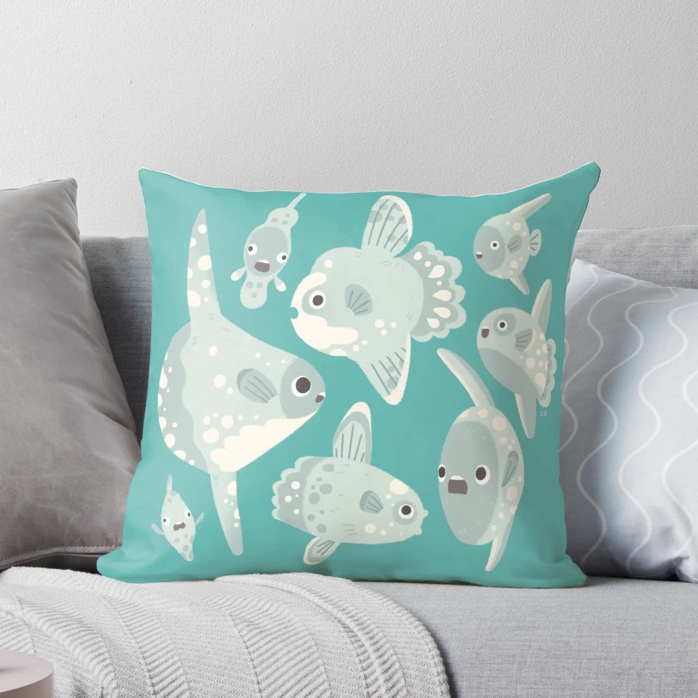 Artistic illustration of a mola mola or ocean sunfish on a decorative throw pillow.