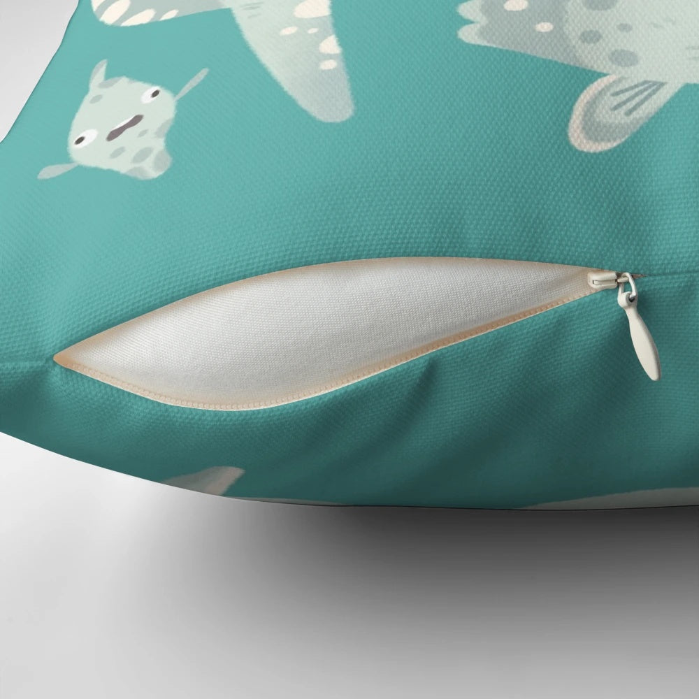 Artistic illustration of a mola mola or ocean sunfish on a decorative throw pillow.