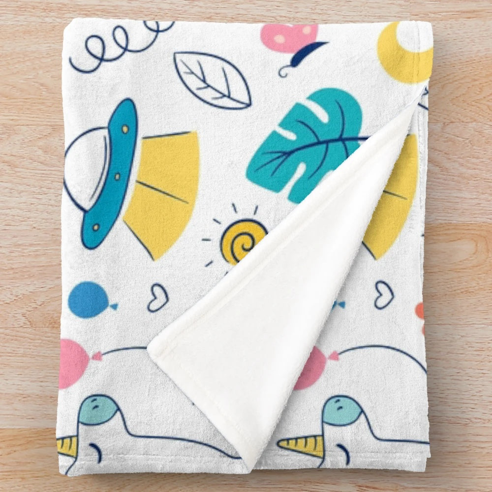 Plush blanket featuring a doodle-style design of cute mythical animals like unicorns and dragons