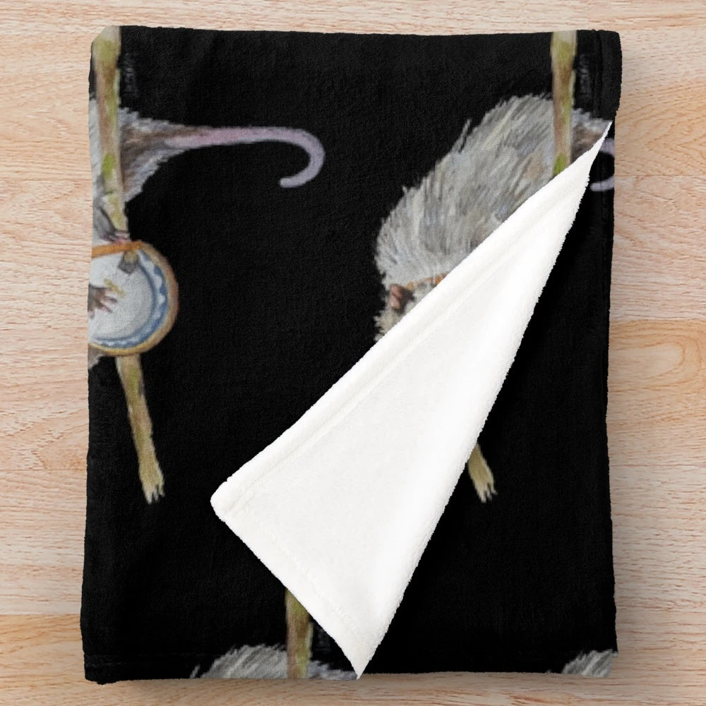 Soft, cozy plush blanket featuring a watercolor illustration of a trash-loving opossum playing the banjo.