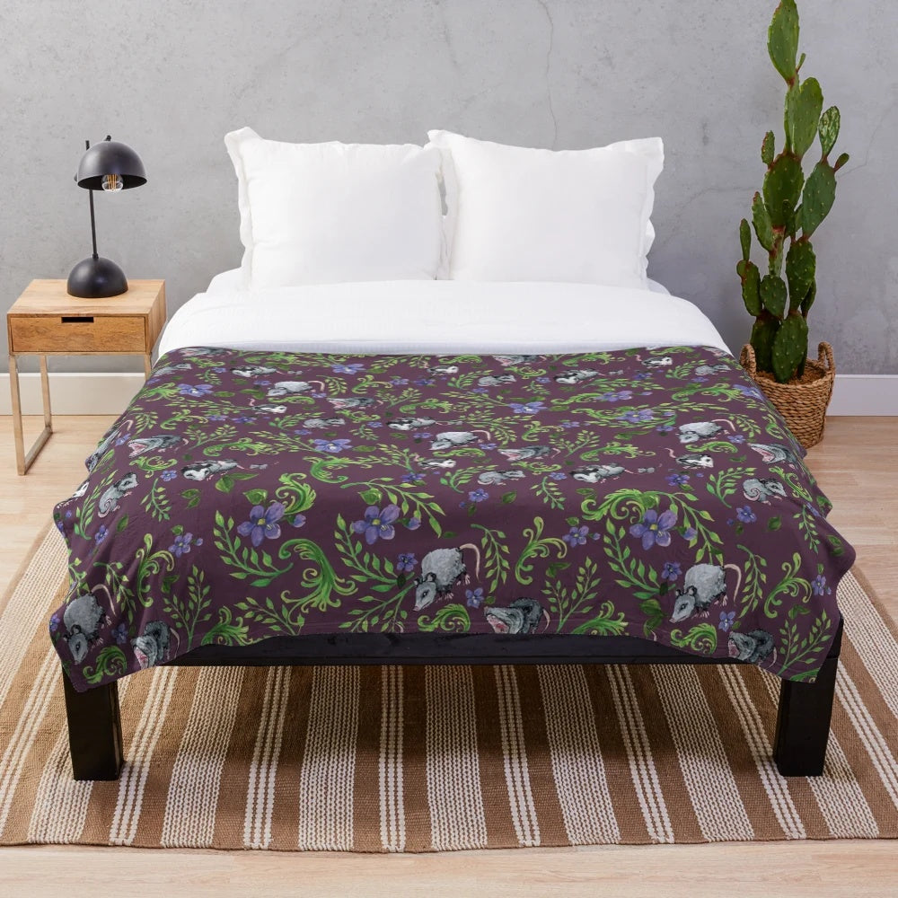 Opossum, fern, and violet print plush blanket