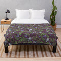 Opossum, fern, and violet print plush blanket