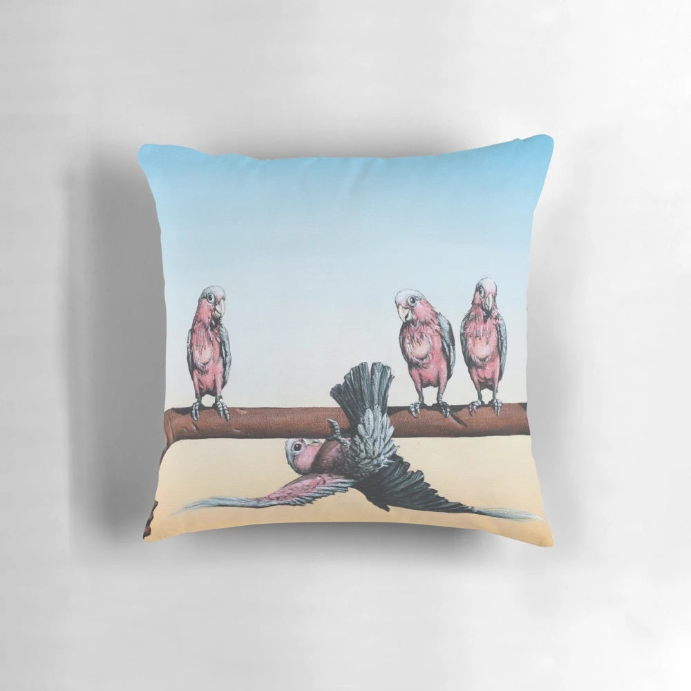A black and white, whimsical illustration of an emu in the Australian outback on a decorative pillow.