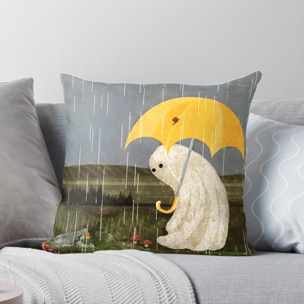 A plush, whimsical pillow featuring a design with rain, nature elements, and a ghost, perfect for cozy, enchanted home decor.