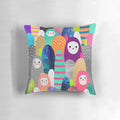 Colorful, nature-inspired pebble spirits pillow with a whimsical design