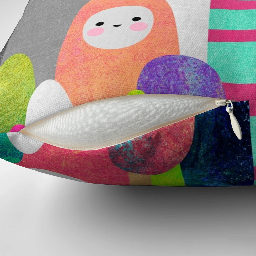 Colorful, nature-inspired pebble spirits pillow with a whimsical design