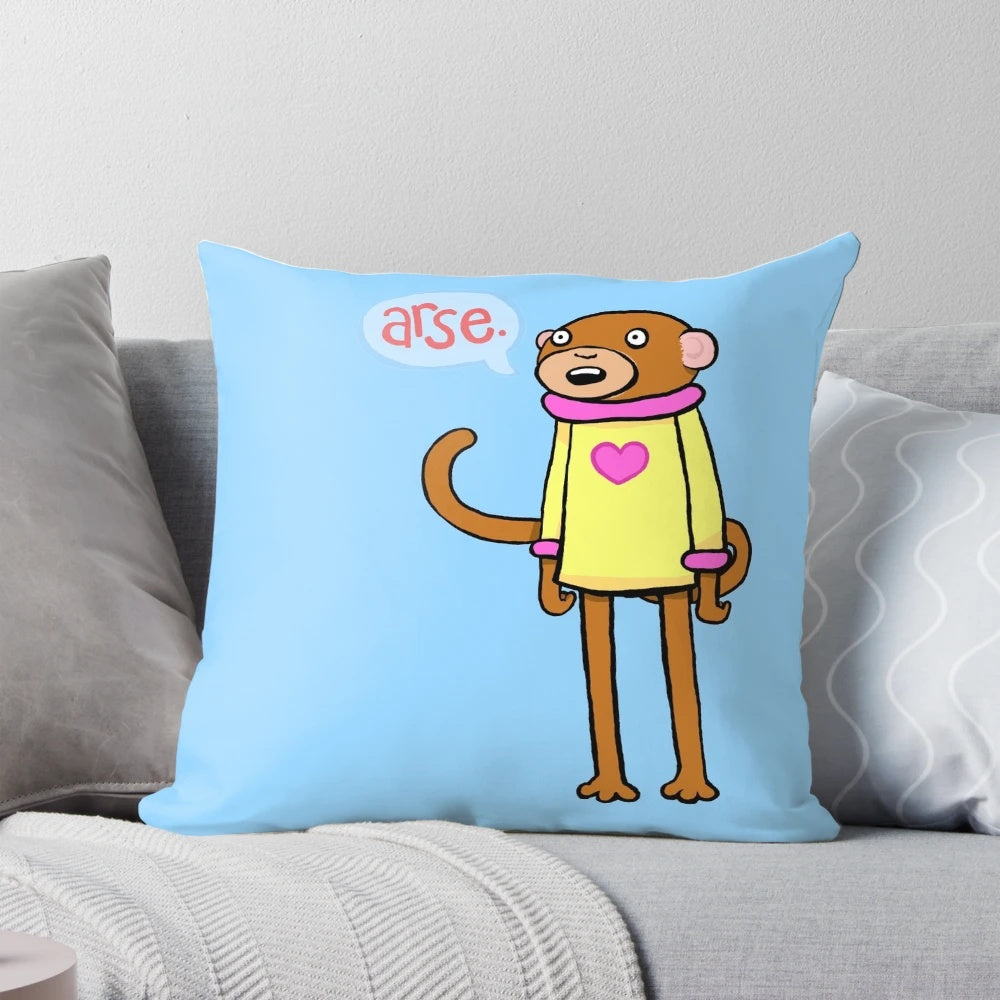 Playful pink monkey-themed decorative pillow with a humorous and cheeky design