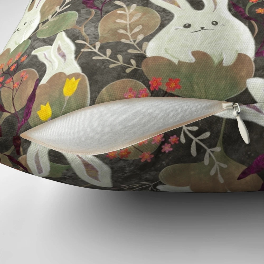 Whimsical decorative pillow with a rabbit and floral pattern design