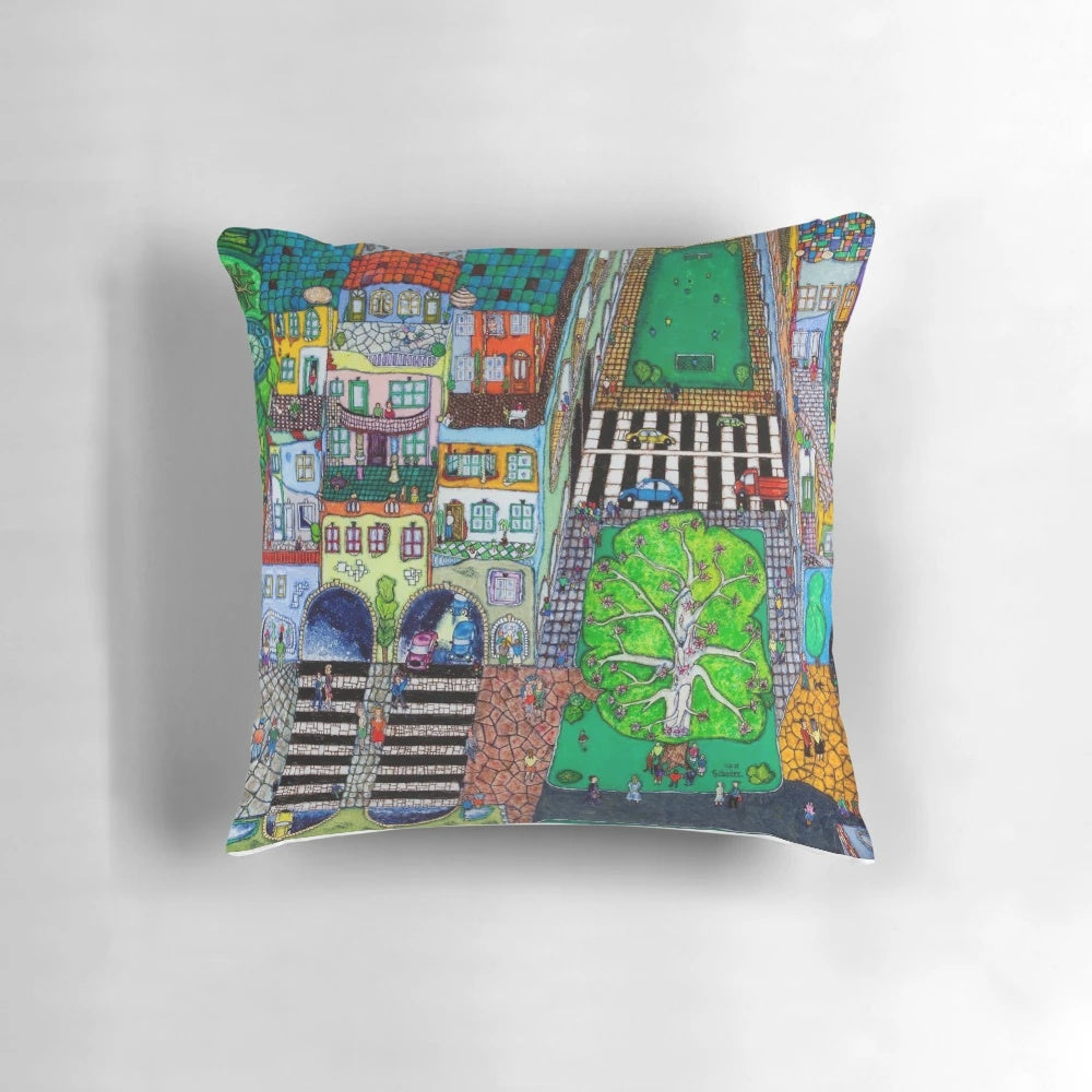 Vibrant, surreal landscape pillow featuring a dreamy, Hundertwasser-inspired city scene in shades of blue and green.