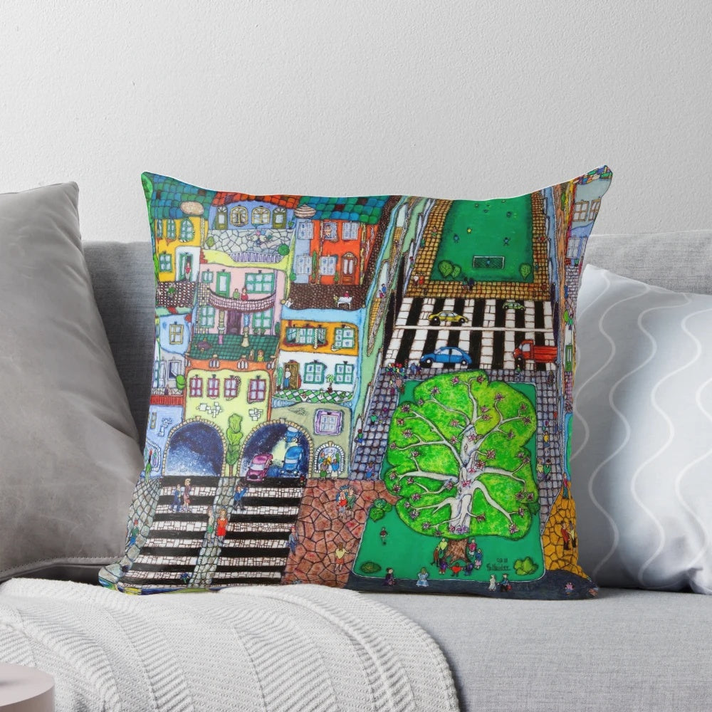 Vibrant, surreal landscape pillow featuring a dreamy, Hundertwasser-inspired city scene in shades of blue and green.