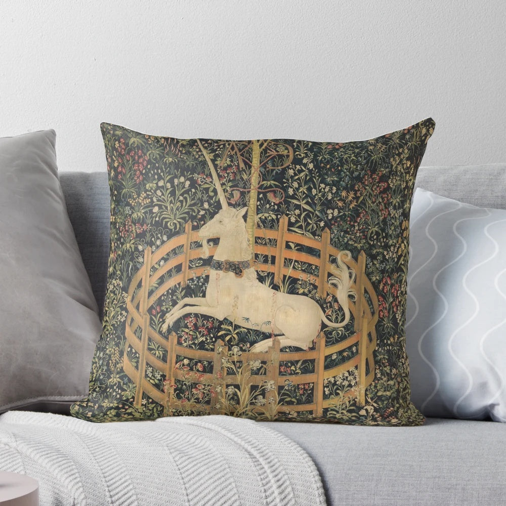 A decorative throw pillow featuring a majestic unicorn in a captivating medieval-style setting, surrounded by lush botanical elements.