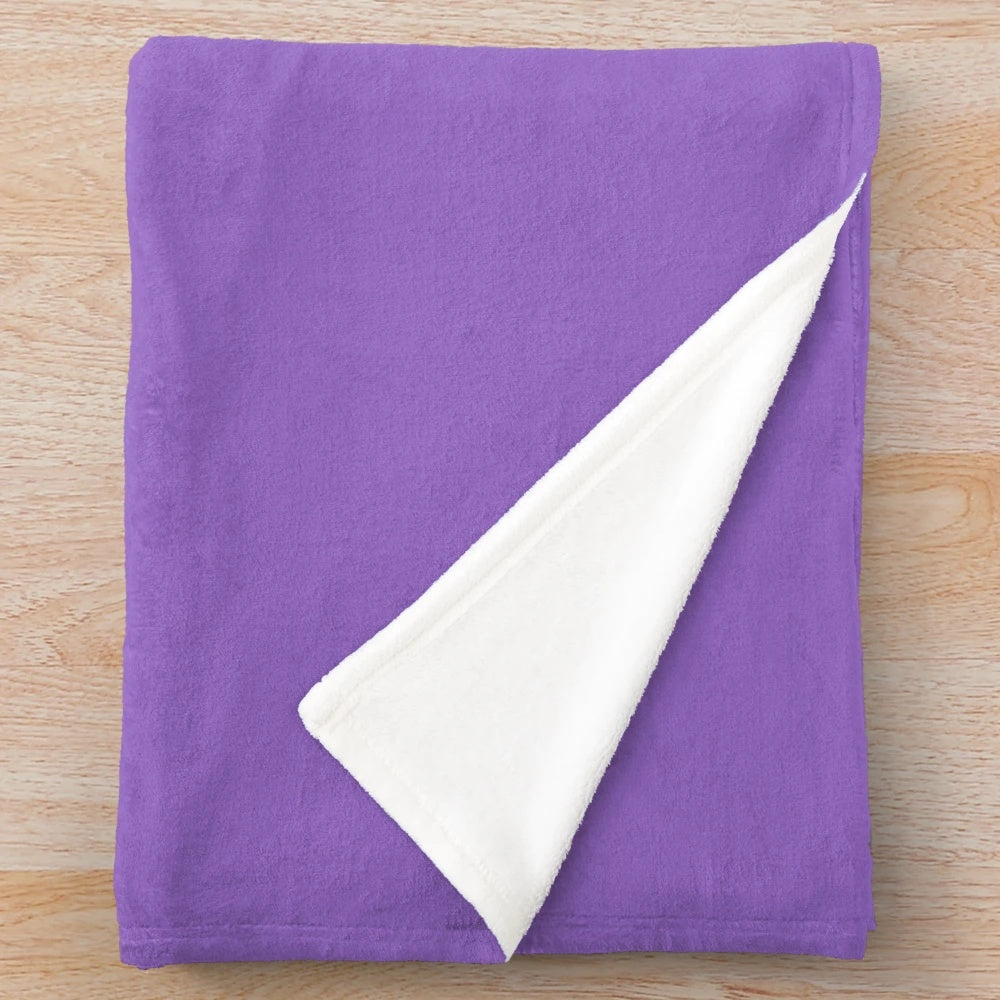 Colorful unicorn plush blanket with whimsical art