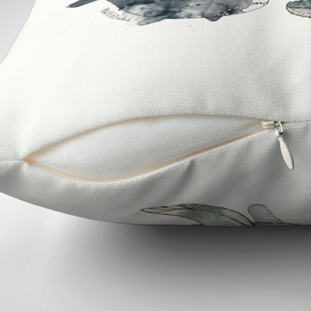 Colorful watercolor painting of whales on a soft, cozy pillow