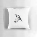 Whimsical whippet peeking out from behind a plush pillow