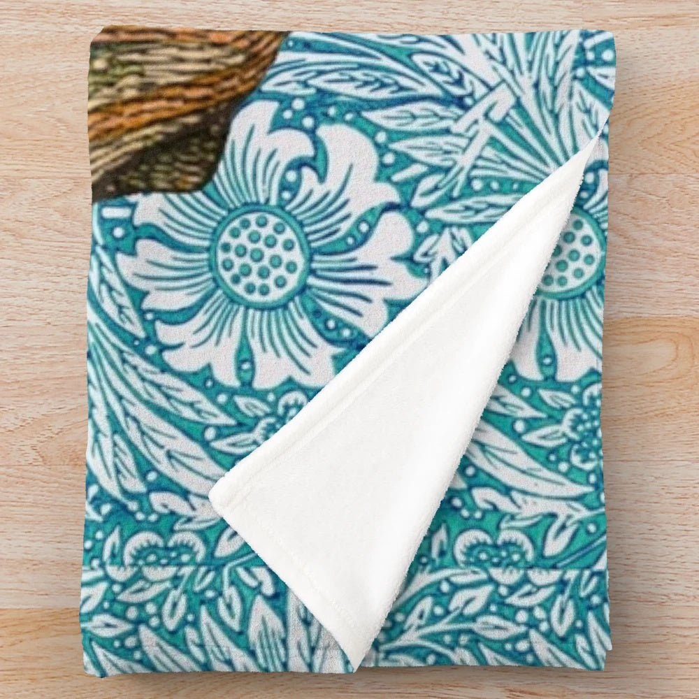 Soft plush blanket featuring a wombat design inspired by Dante Gabriel Rossetti's artwork and William Morris' blue marigold floral pattern