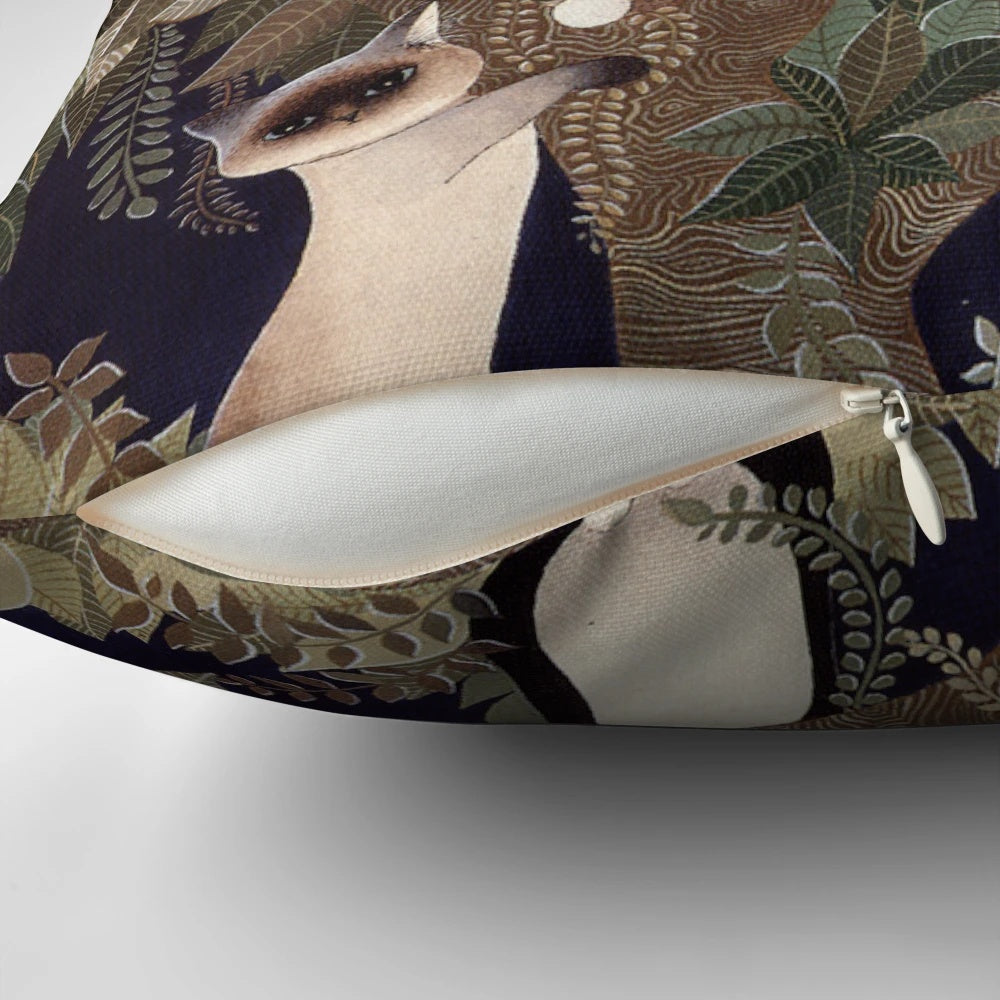A beautifully designed pillow featuring a tree with whiskered cats in a harmonious symphony
