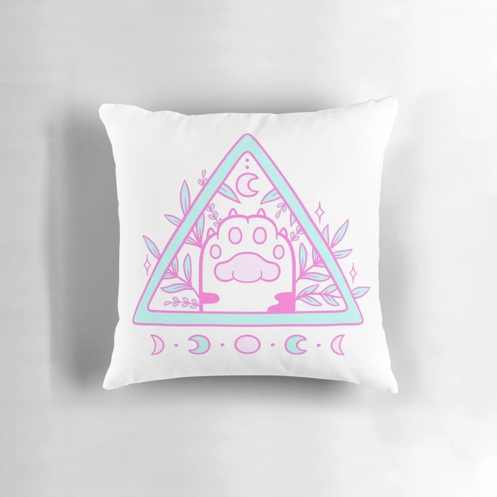 Pastel white and pink cat paw print Nikury pillow with occult and moon motifs