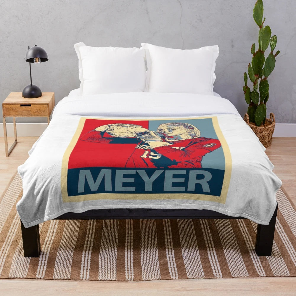 Women's plush blanket featuring a tribute design for Katie Meyer, a former collegiate goalkeeper