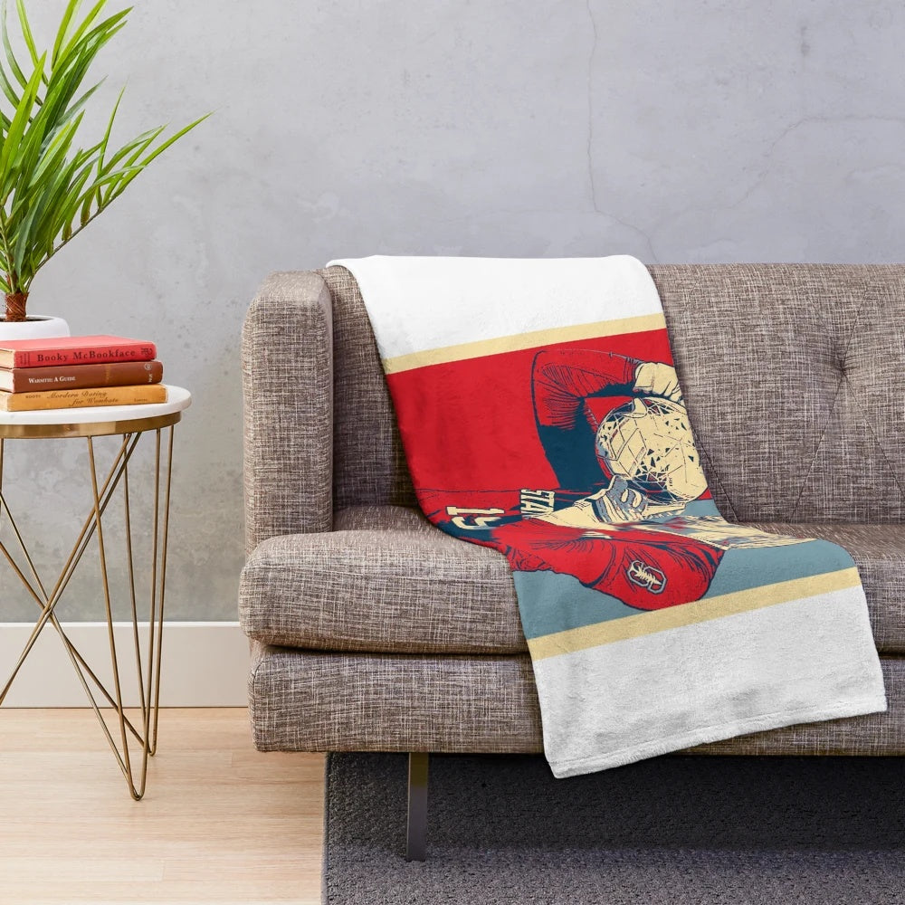 Women's plush blanket featuring a tribute design for Katie Meyer, a former collegiate goalkeeper