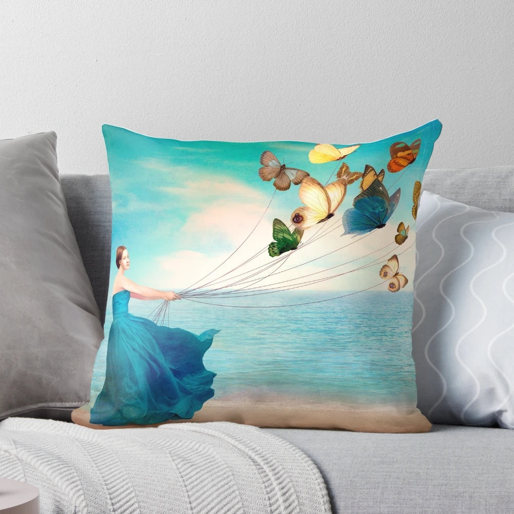 Artistic Wonderland-themed pillow featuring a serene ocean landscape with floating butterflies, designed by artist Christian Schloe.