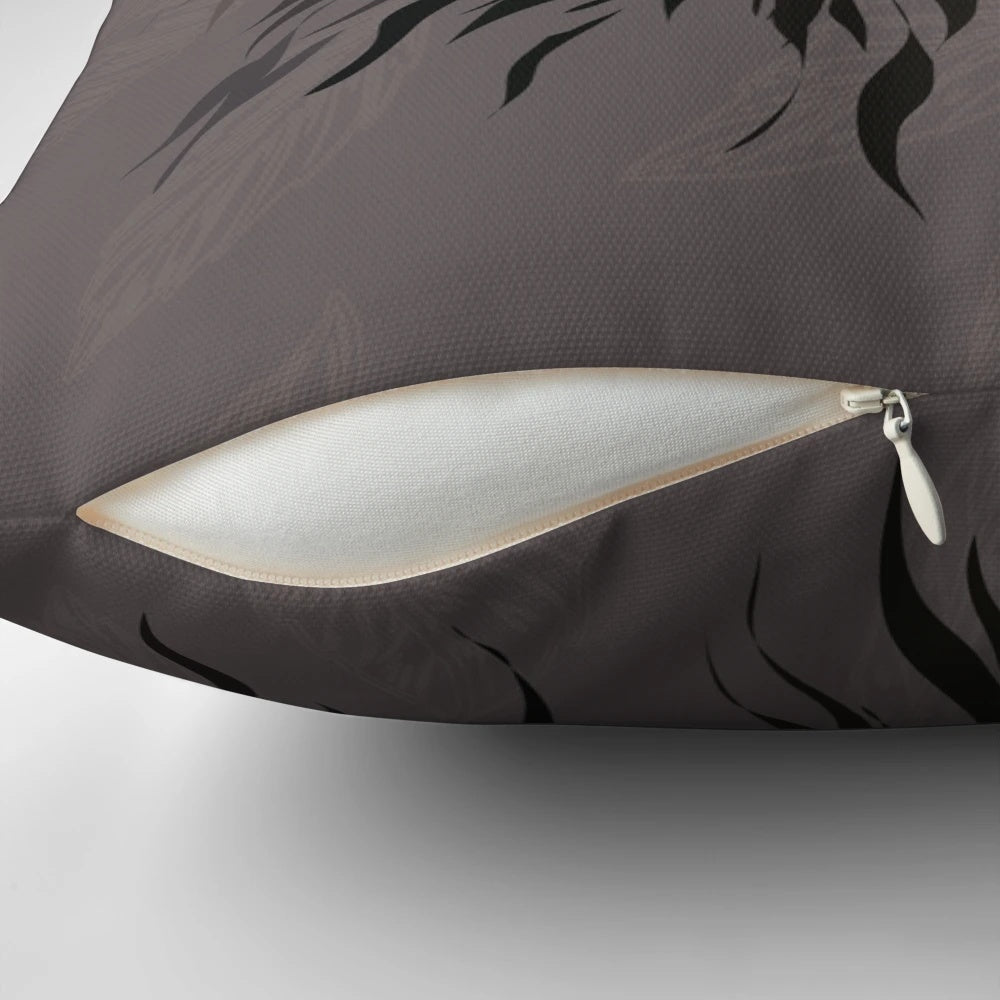 Woodland-themed black, white, and grey badger print pillow with twig details
