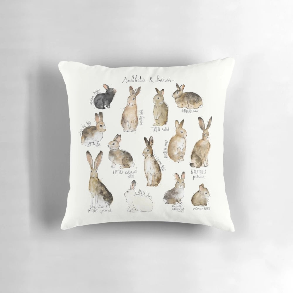 A decorative throw pillow featuring illustrations of various rabbit and hare species in a natural, wildlife-inspired design.