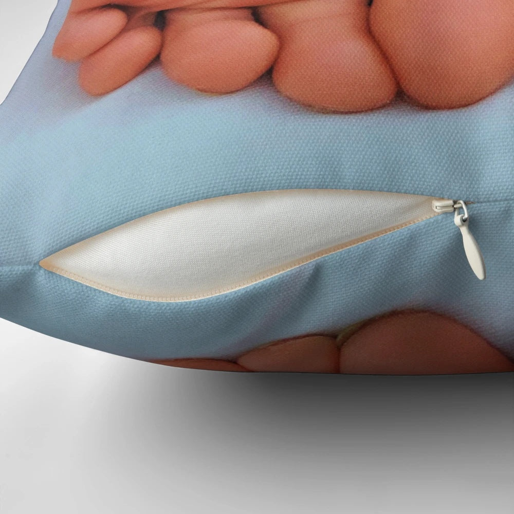 Close-up of wrinkled, pink soles on a plush pillow, perfect for foot fetish enthusiasts.
