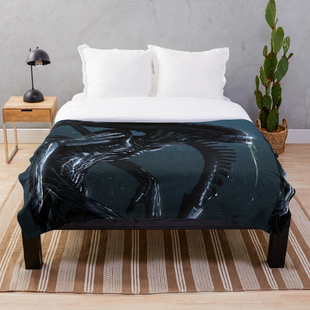 Xenomorph-inspired plush blanket with HR Giger-style alien design