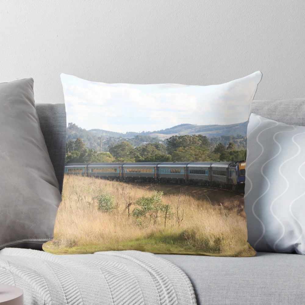 XPT high-speed train traveling through a picturesque landscape printed on a pillow