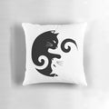A black and white throw pillow featuring a yin yang cats design illustration