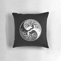 White and black yin yang tree of life design on a decorative pillow