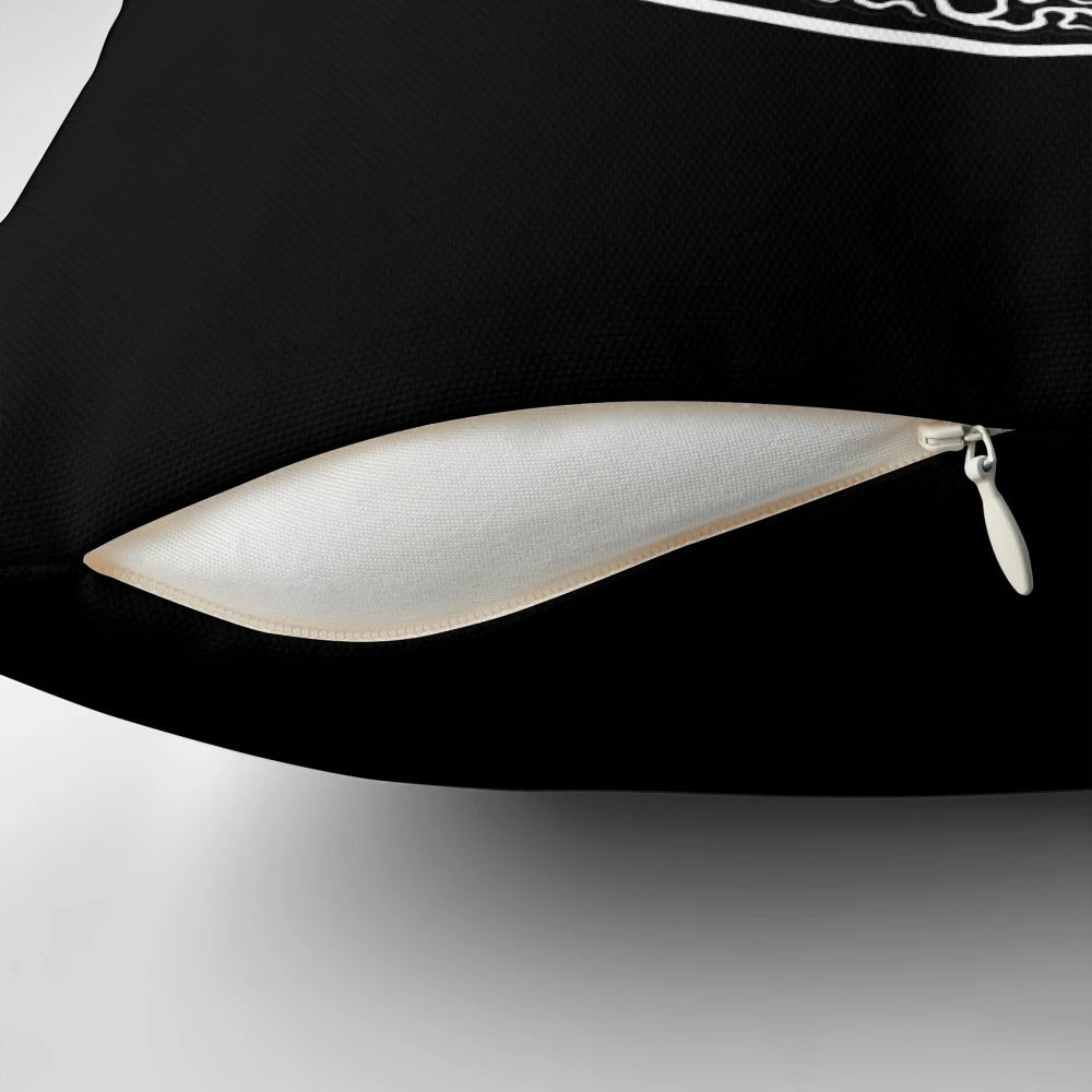 White and black yin yang tree of life design on a decorative pillow