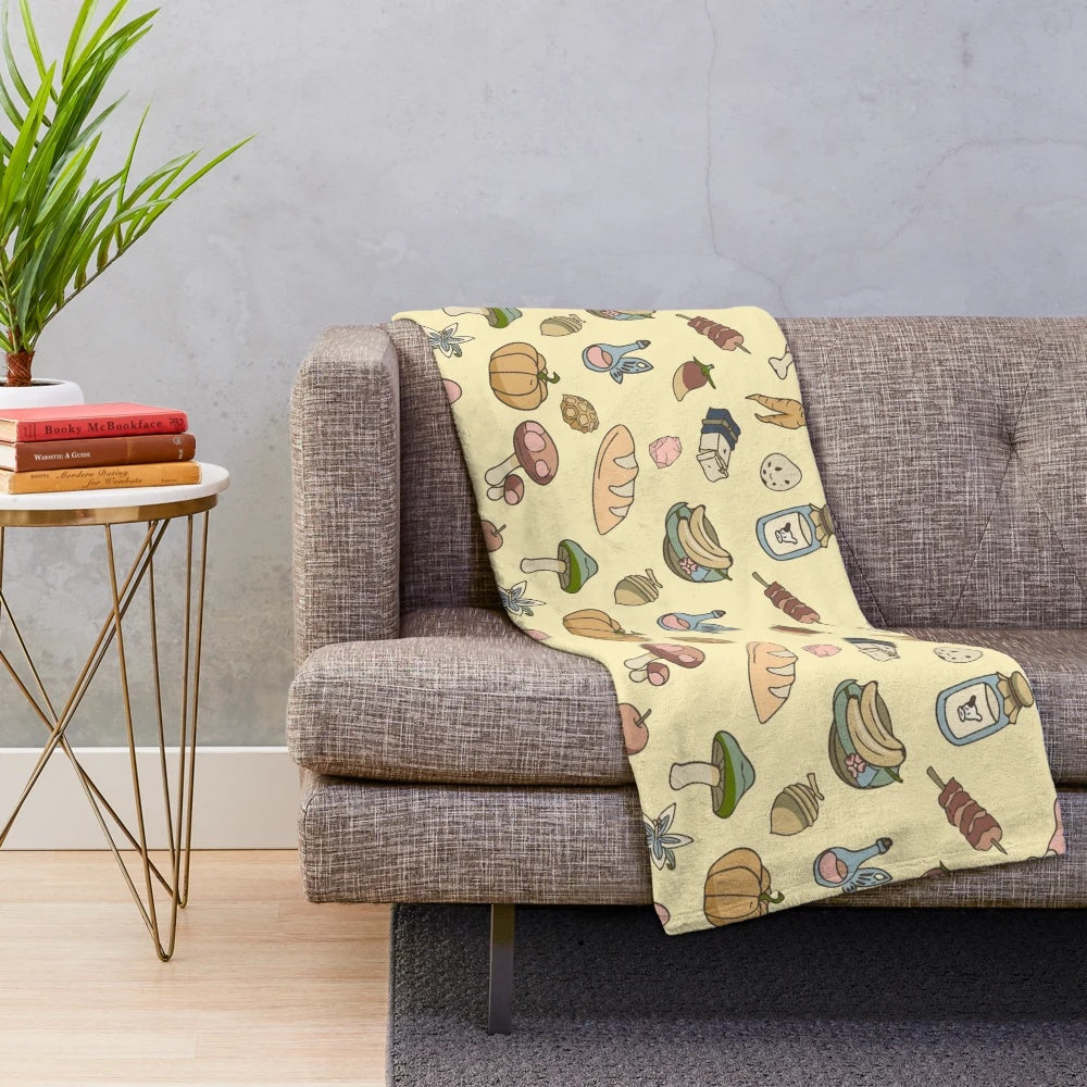 Zelda-inspired yellow plush blanket with Hylian symbols and characters