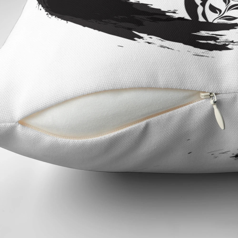 Pillow featuring a minimalist, zen-inspired enso circle design and a tree of life motif