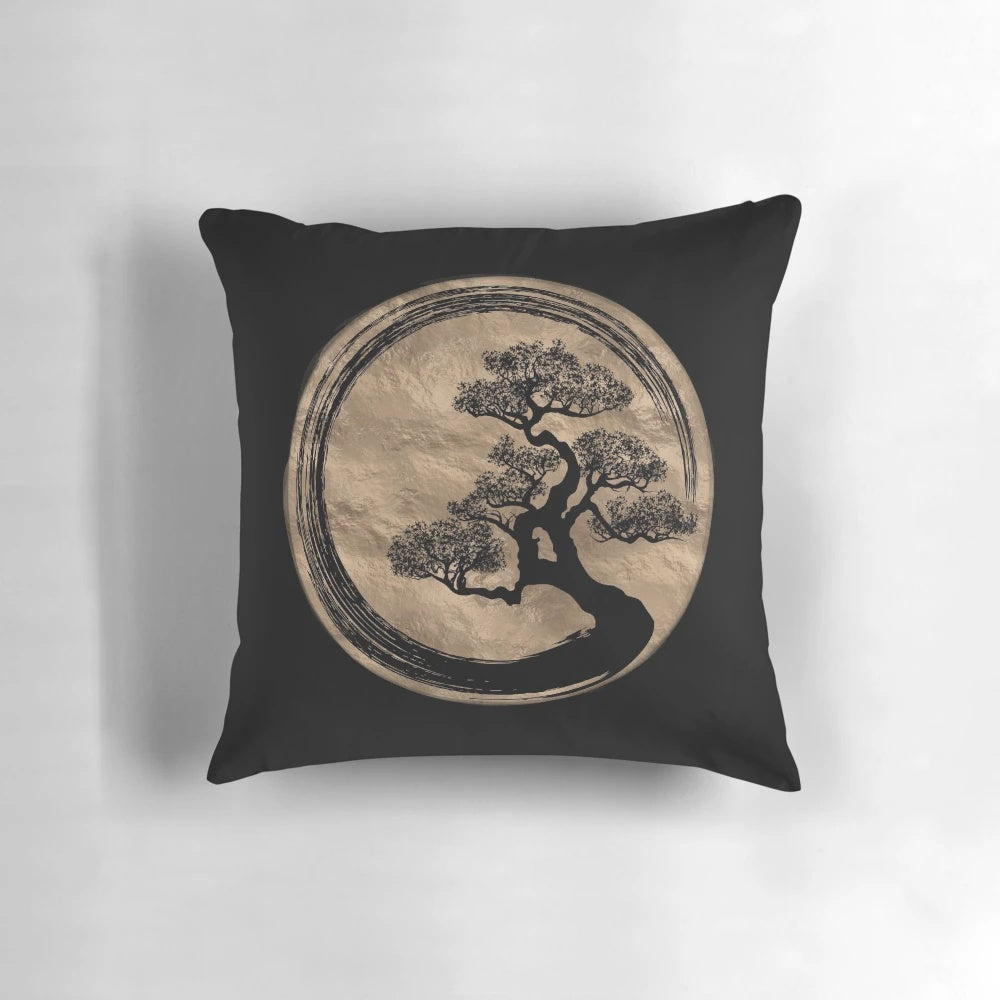 A gold pillow featuring a minimalist enso circle and bonsai tree design, perfect for zen-inspired home decor.