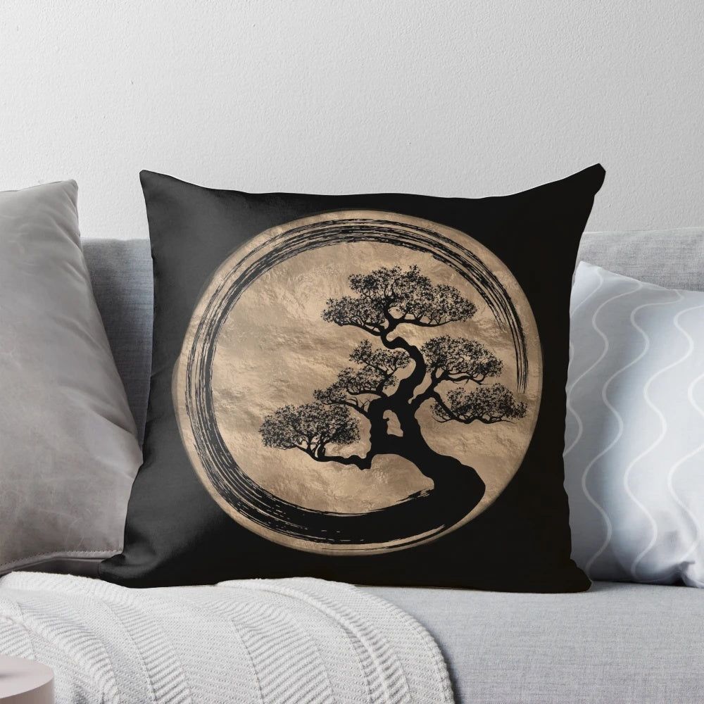 A gold pillow featuring a minimalist enso circle and bonsai tree design, perfect for zen-inspired home decor.