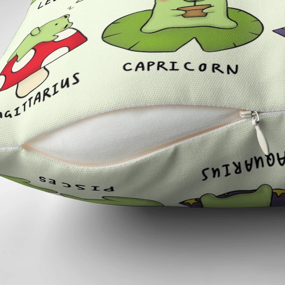 Decorative pillow featuring tiny frog illustrations representing the different zodiac signs
