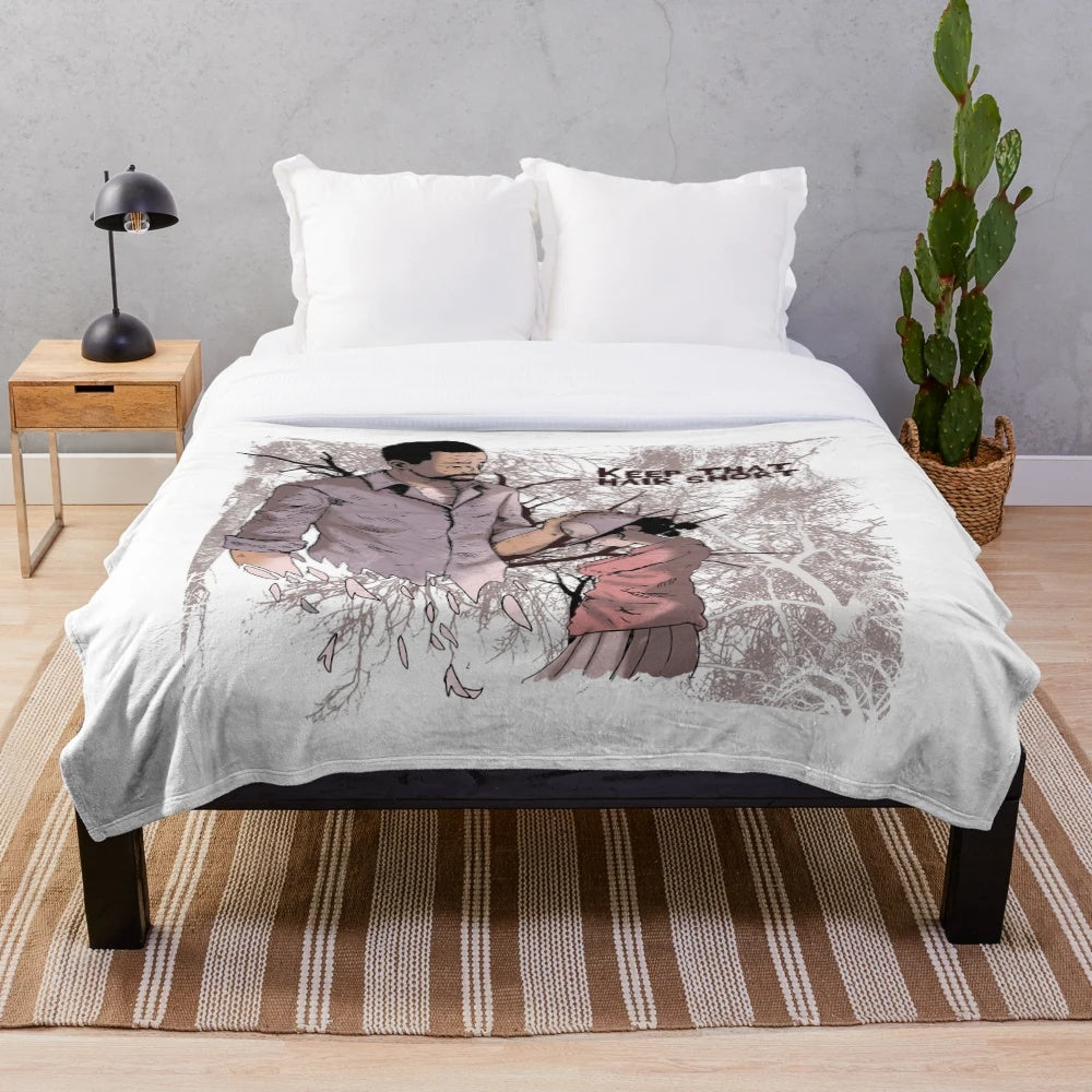 Walking Dead characters Lee and Clementine on a plush blanket