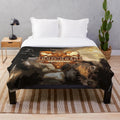 Zombie-themed plush blanket featuring Dixon Extermination Service design